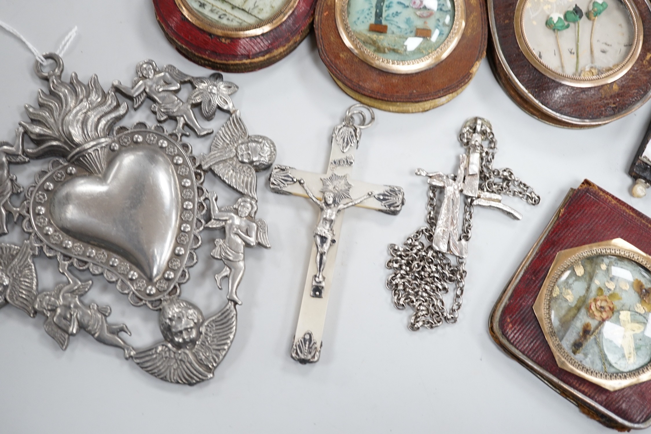 A group of catholic related collectables including Corpus Christi, rosary bead holders etc.